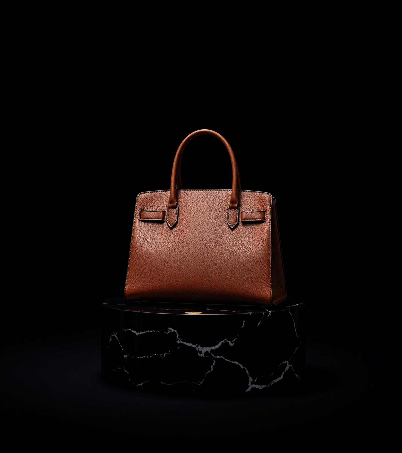Signature handbag on black marble